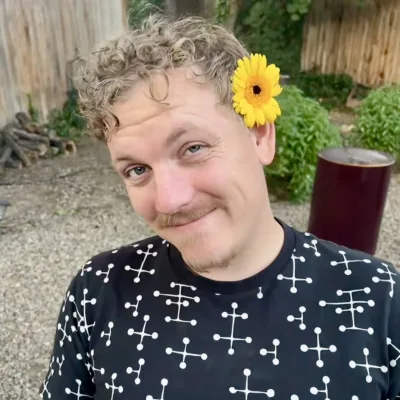 Mike Elliott with a flower in his hair